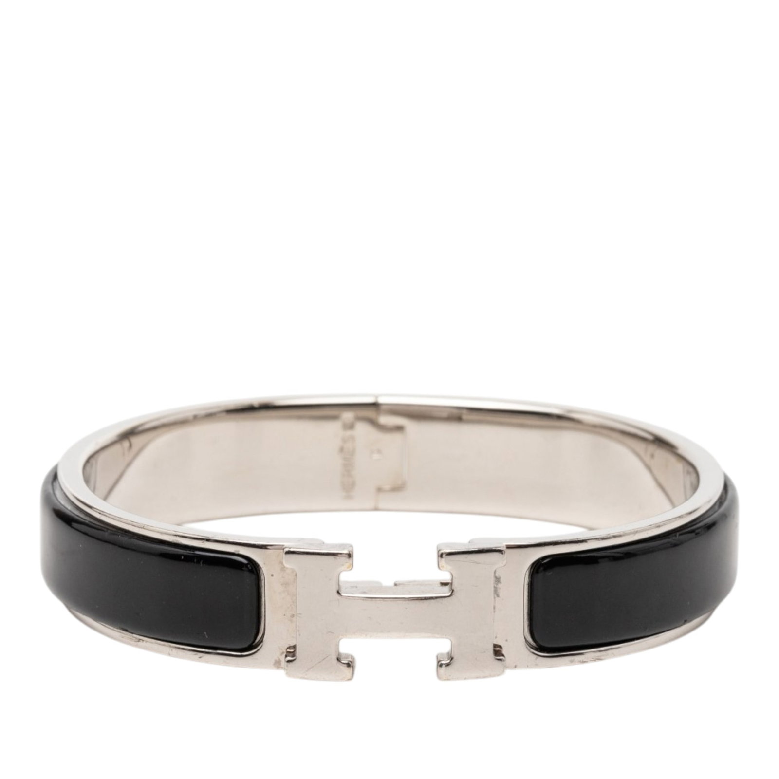 Hermes Clic H Narrow Enamel Bracelet PM Black: Hermes Clic H Narrow Enamel Bracelet PM Black This Hermes Narrow Enamel Clic H Bracelet PM features a palladium-plated metal and enamel body, complemented by the signature H toggle clasp. The bracelet