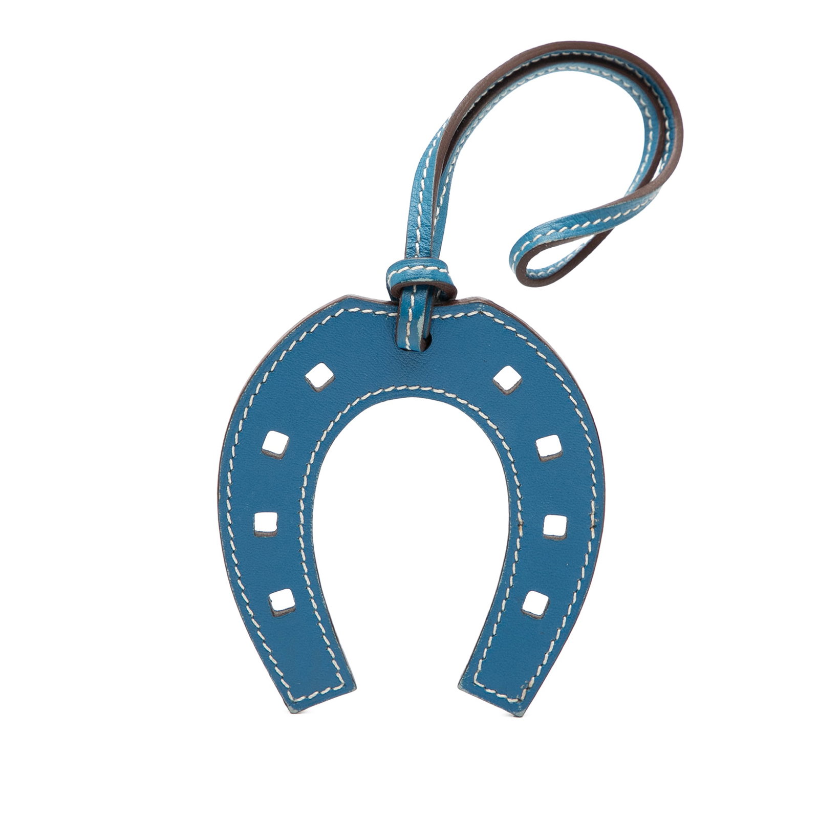Hermes Blue Jean Swift Leather Horseshoe Bag Charm Accessory: Hermes Blue Jean Swift Leather Horseshoe Bag Charm Accessory This bag charm features a Blue Jean swift leather body with a flat strap, designed in the shape of a horseshoe. It is an accessory from Fra