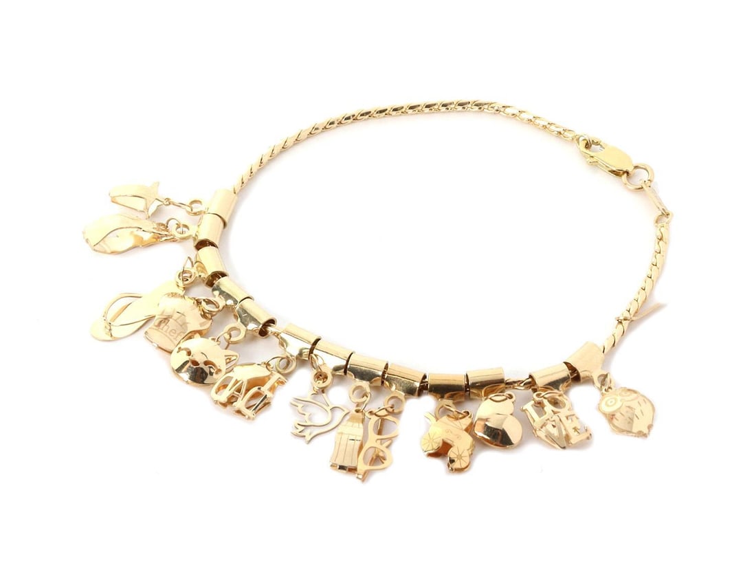 14k Yellow Gold 13 Charm Bracelet with Flowers Animals Landmarks: 14k Yellow Gold 13 Charm Bracelet with Flowers Animals Landmarks This exquisite bracelet is crafted from 14k yellow gold and features 13 charming pendants, including flowers, animals, handbags, and ic