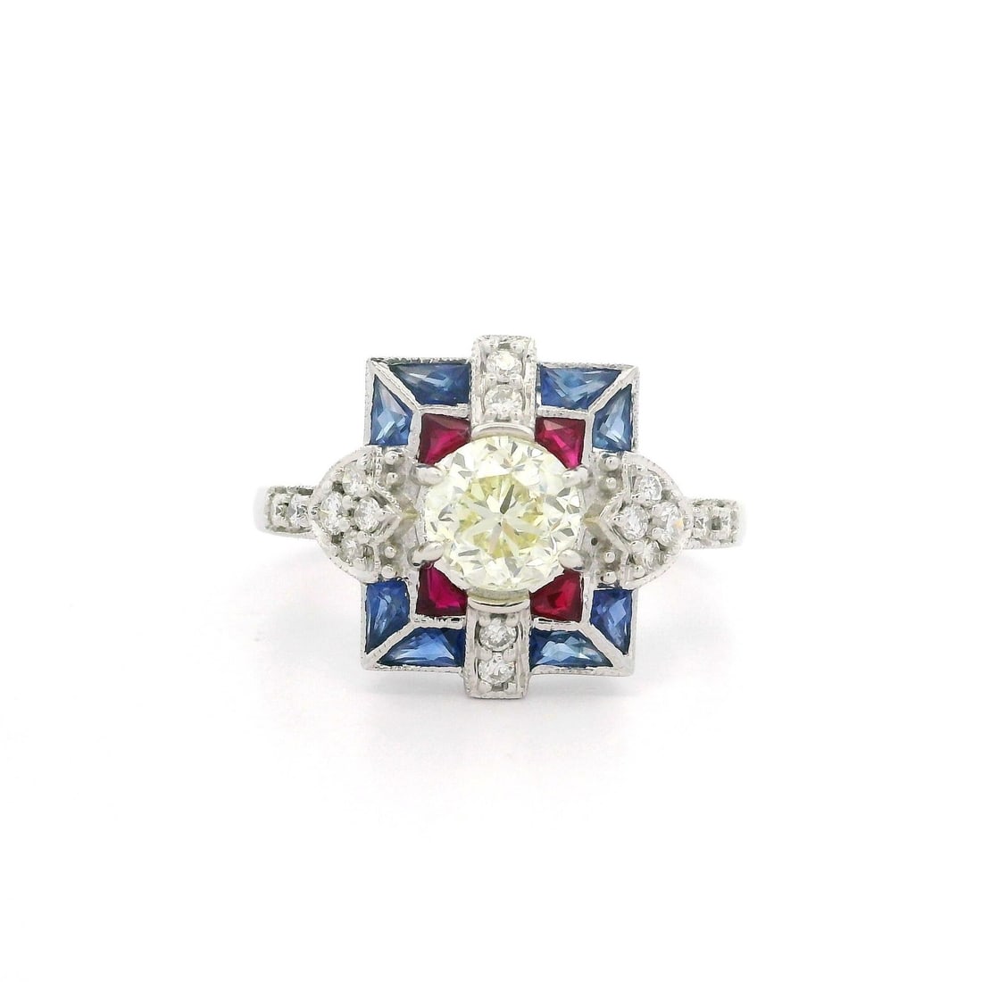 18k White Gold Cocktail Ring with 1.17ctw Diamonds Rubies and Sapphires: 18k White Gold Cocktail Ring with 1.17ctw Diamonds Rubies and Sapphires This stunning cocktail ring features a captivating design crafted in solid 18k white gold. At its center lies a natural, chunky 