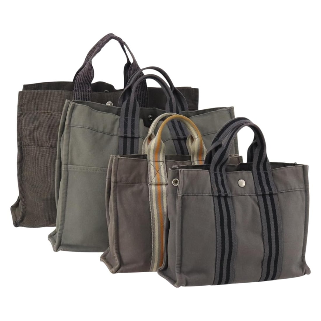 Set of Four Hermes Gray Canvas Tote Bags with Padlock Accessory: Set of Four Hermes Gray Canvas Tote Bags with Padlock Accessory This Hermes tote bag set features four pieces crafted from gray cotton canvas, designed for women. Made in France, the set includes a pa