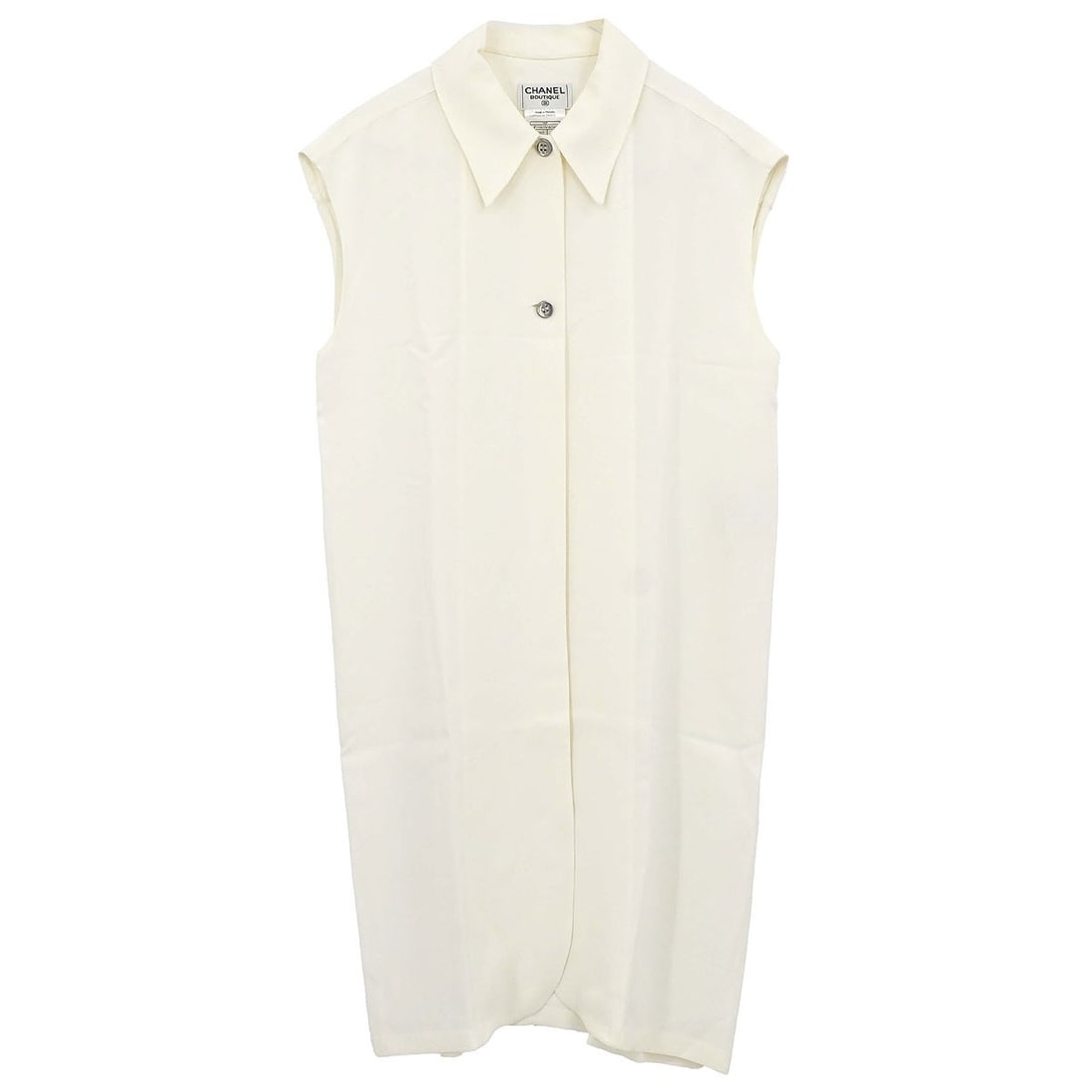 CHANEL white sleeveless midi vest dress size 38: CHANEL white sleeveless midi vest dress size 38 This vintage Chanel sleeveless long vest dress in white offers a sophisticated and timeless look. Crafted from a blend of 52% rayon and 48% acetate, the