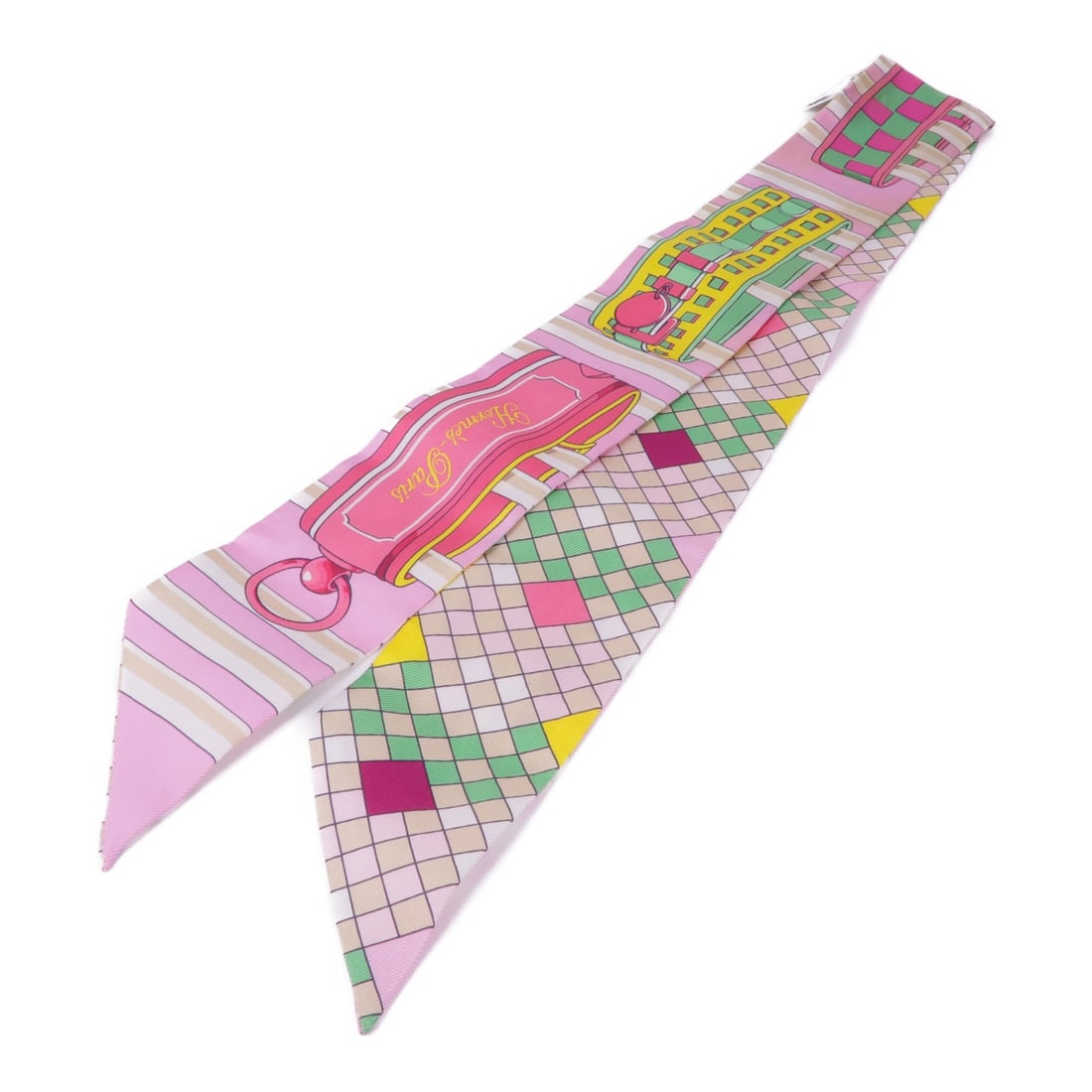 Hermes Twilly silk pink scarf: Hermes Twilly silk pink scarf This Hermes Twilly scarf is crafted from luxurious silk in a vibrant pink hue. Designed for women, it features a classic scarf style and is made in France, reflecting the