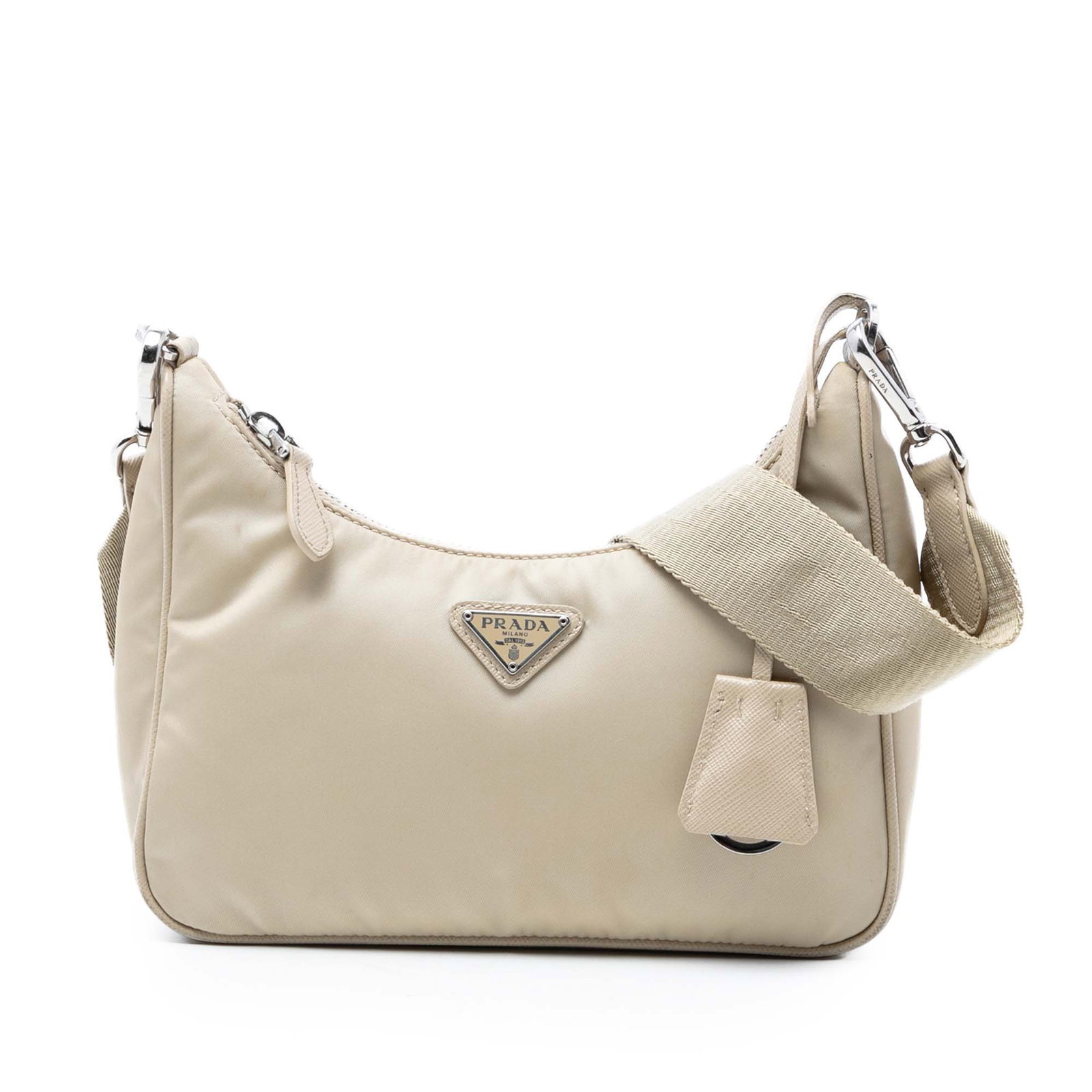 Prada Beige Nylon Shoulder Bag Re Edition 2005: Prada Beige Nylon Shoulder Bag Re Edition 2005 This Prada Re Nylon Re Edition 2005 Shoulder Bag features a durable beige nylon body complemented by a flat Saffiano leather strap and a secure top zip c