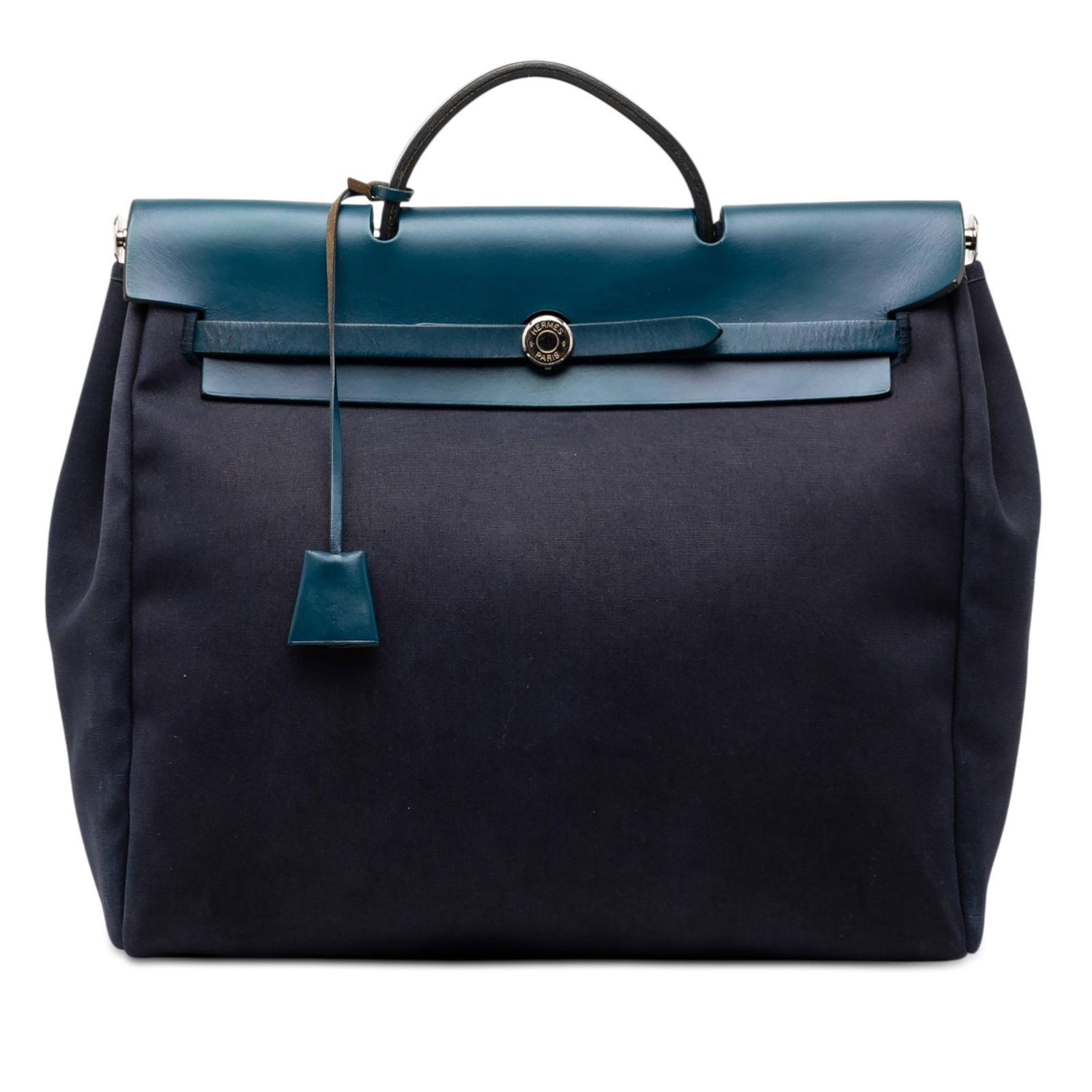 Hermes Toile Herbag MM blue canvas bag: Hermes Toile Herbag MM blue canvas bag This Hermes Toile Herbag MM features a blue canvas body complemented by a flat leather handle and a detachable flat leather strap. The bag is secured with a top 
