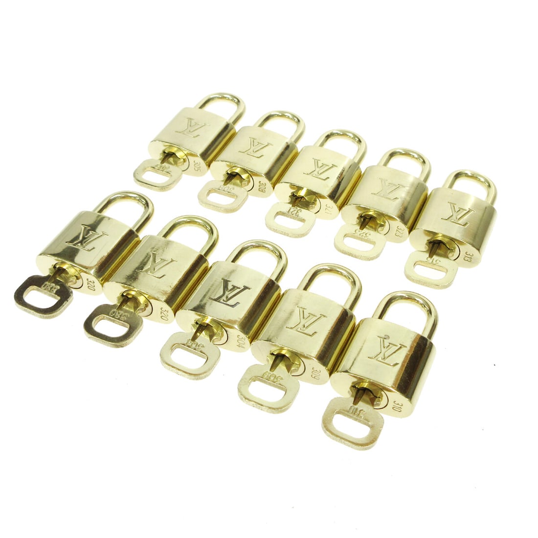 Louis Vuitton gold padlock key charm set 10 pieces: Louis Vuitton gold padlock key charm set 10 pieces This is a set of ten Louis Vuitton gold padlocks with matching keys, designed as bag accessories or charms. Made in France and featuring the iconic L