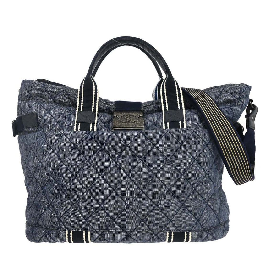 CHANEL blue quilted denim tote with Airlines buckle: CHANEL blue quilted denim tote with Airlines buckle This Chanel Blue Quilted Denim Airlines Buckle 2way Tote Handbag features a stylish quilted denim exterior with signature logo accents. Designed for