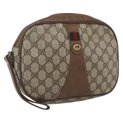 Gucci Sherry Line GG Supreme Beige Gold Clutch Bag: Gucci Sherry Line GG Supreme Beige Gold Clutch Bag This GUCCI GG Supreme Web Sherry Line clutch bag features a beige and gold color scheme and is crafted from PVC leather and GG canvas. Made in Italy,