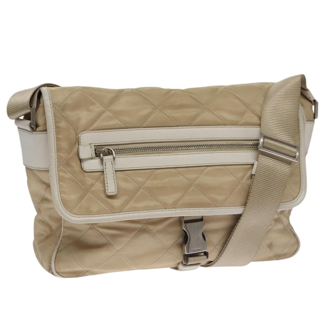 PRADA Beige Silver Nylon Shoulder Bag Italy: PRADA Beige Silver Nylon Shoulder Bag Italy This PRADA shoulder bag is crafted from beige nylon with silver-tone accents. Designed for women, it features a spacious main compartment and an adjustable 