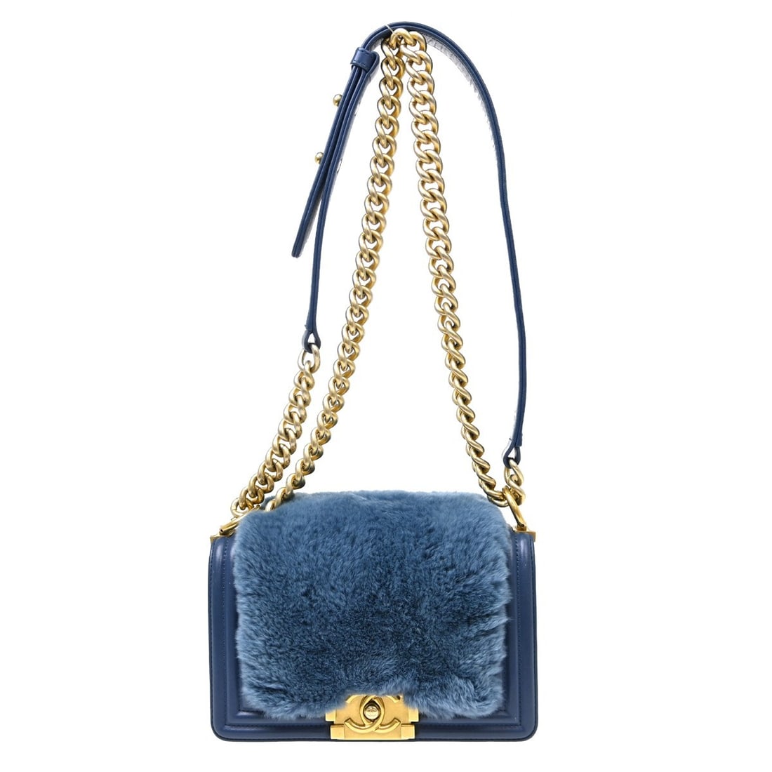CHANEL Boy Blue Fur Leather Mini Chain Strap Bag: CHANEL Boy Blue Fur Leather Mini Chain Strap Bag This Boy Chanel small chain shoulder bag features a blue fur leather exterior with a matching blue fabric lining. The bag is designed with a clasp flap