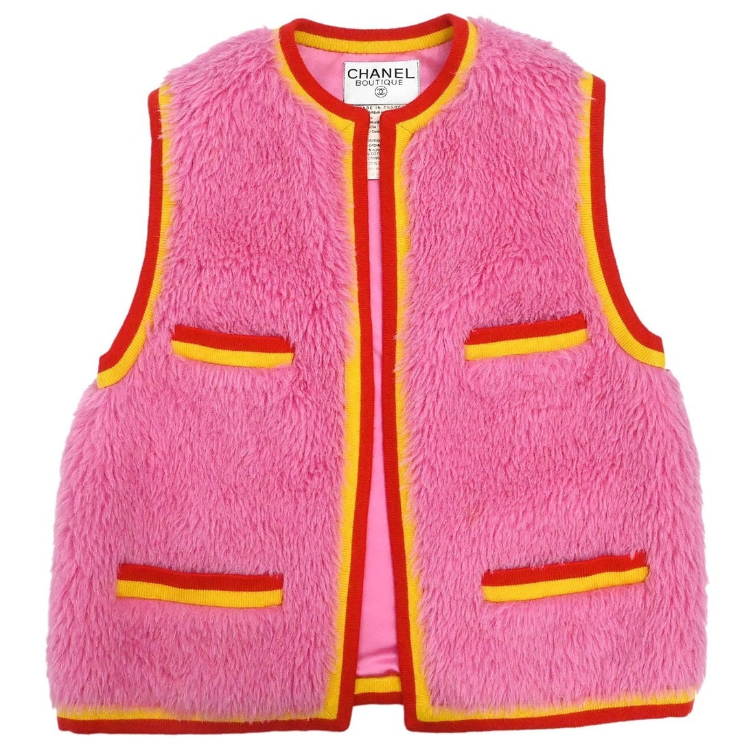 Chanel Pink Cashmere Alpaca Cotton Sleeveless Jacket Size 40: Chanel Pink Cashmere Alpaca Cotton Sleeveless Jacket Size 40 This vintage Chanel single breasted jacket vest features a mid-length, sleeveless design in a striking pink hue. Crafted from a luxurious b