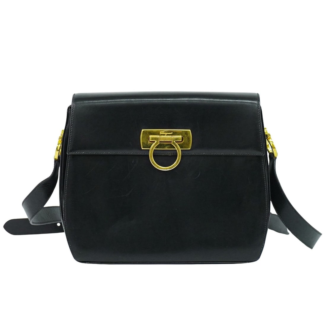 Black Leather Gancini Shoulder Bag by Salvatore Ferragamo: Black Leather Gancini Shoulder Bag by Salvatore Ferragamo This Salvatore Ferragamo Gancini shoulder bag is crafted from black leather and designed for women. It features the classic Gancini motif, wit