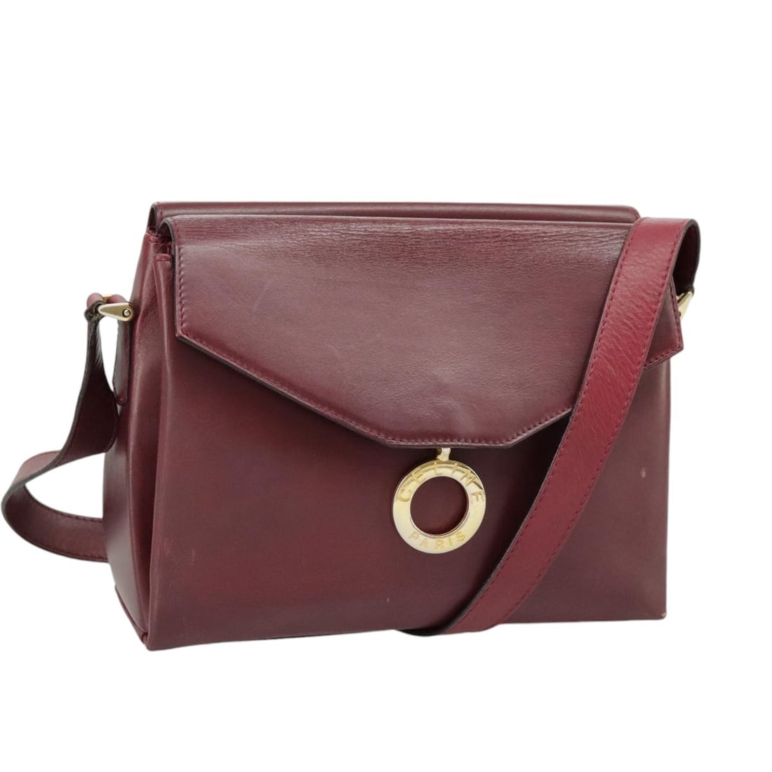 CELINE Wine Red Leather Shoulder Bag Gold Tone Italy: CELINE Wine Red Leather Shoulder Bag Gold Tone Italy This CELINE shoulder bag is crafted from wine red leather with gold-tone accents. Designed for women, it features an adjustable shoulder strap and 