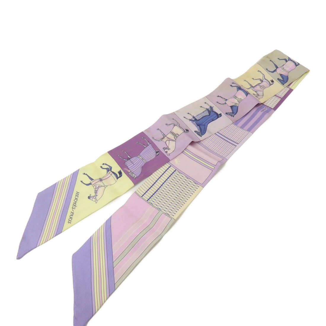 Hermes Twilly Purple Silk Scarf: Hermes Twilly Purple Silk Scarf This Hermes Twilly scarf is crafted from luxurious silk in a vibrant purple hue. Designed for women, it showcases the brand's signature elegance and is made in France. 