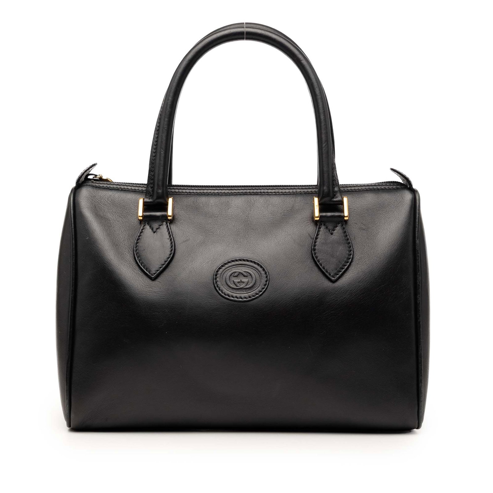 Black Gucci leather top zip handbag with dust bag: Black Gucci leather top zip handbag with dust bag This Gucci Calfskin Handbag is crafted from leather and features rolled leather handles, a top zip closure, and an interior zip pocket. The bag is mad