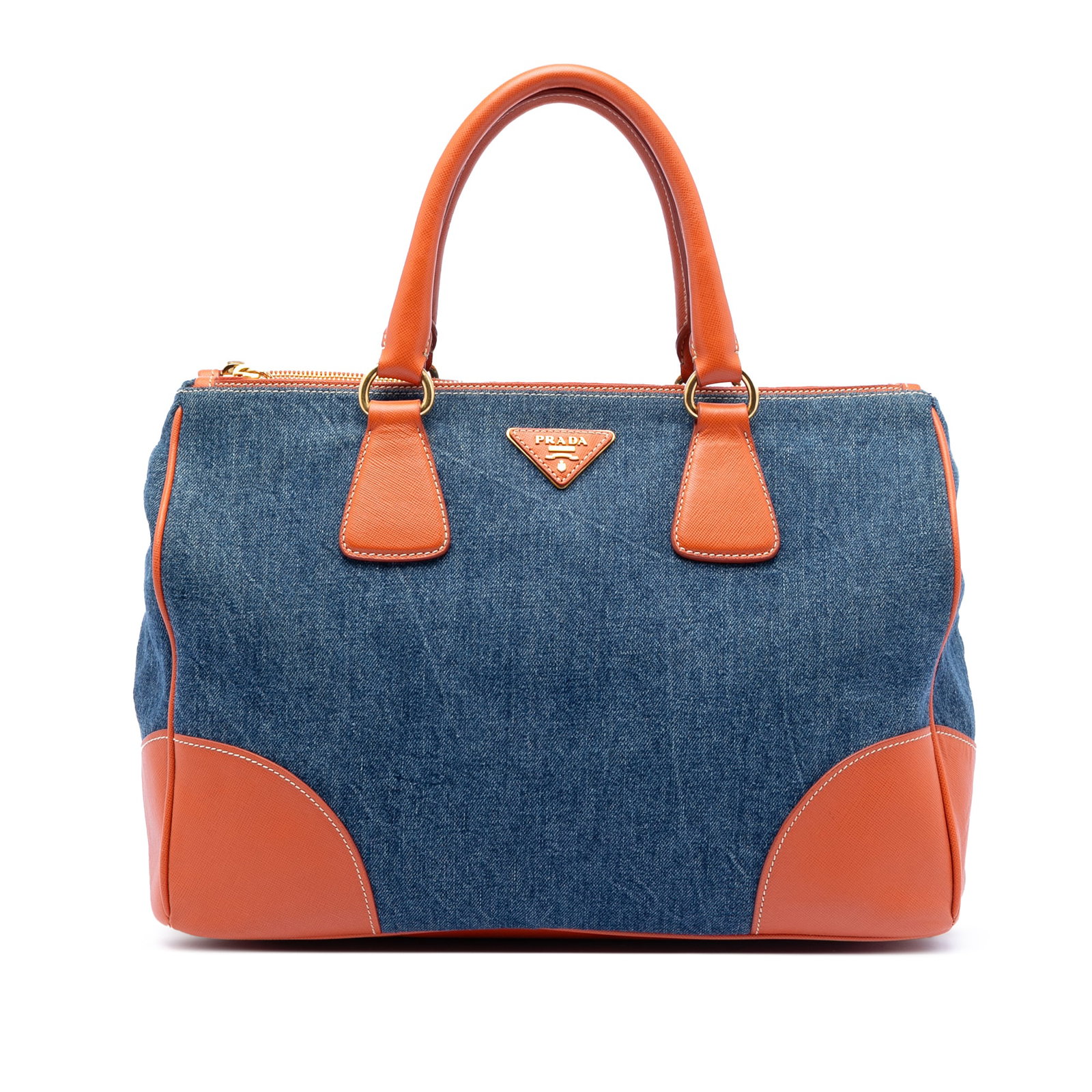 Blue Denim Tote with Saffiano Leather Accents by Prada: Blue Denim Tote with Saffiano Leather Accents by Prada This Prada Saffiano Trimmed Denim Handbag features a blue denim body complemented by Saffiano leather trim and rolled leather handles. The design
