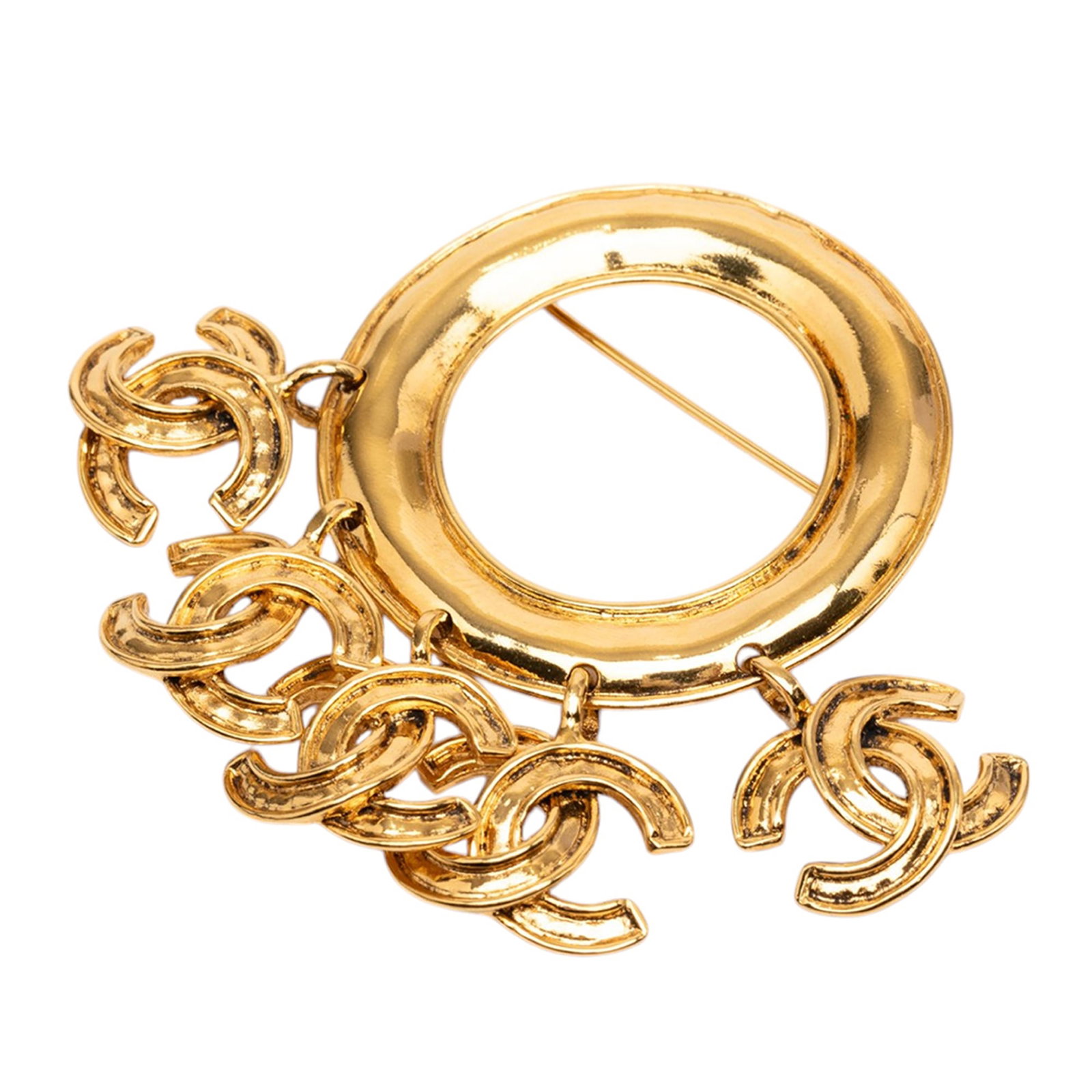 Chanel gold-tone metal charm brooch ring: Chanel gold-tone metal charm brooch ring This Chanel brooch features a gold-tone metal body adorned with five distinctive charms and is equipped with a back pin closure. Crafted in France, it is class
