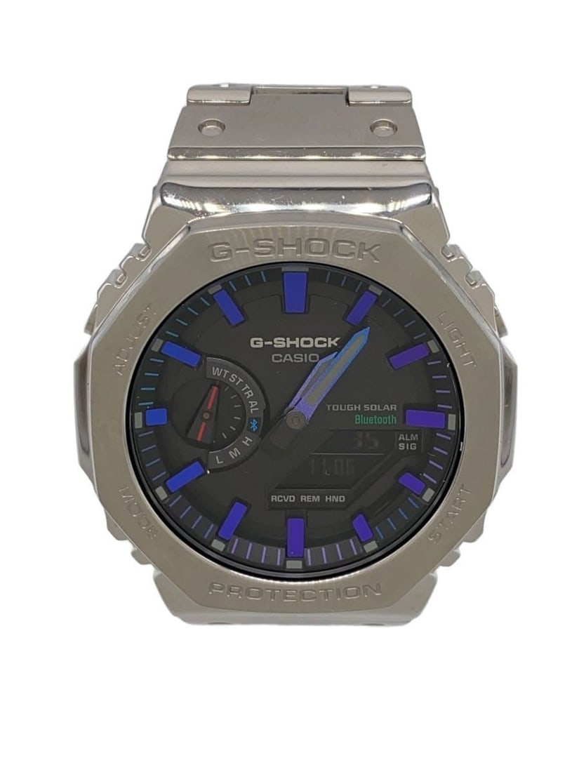 Casio G Shock GM-B2100PC-1AJF stainless steel wristwatch: Casio G Shock GM-B2100PC-1AJF stainless steel wristwatch This CASIO G-SHOCK Full Metal 2100 Series wristwatch, model GM-B2100PC-1AJF, features an octagonal case design with a striking rainbow accent. 