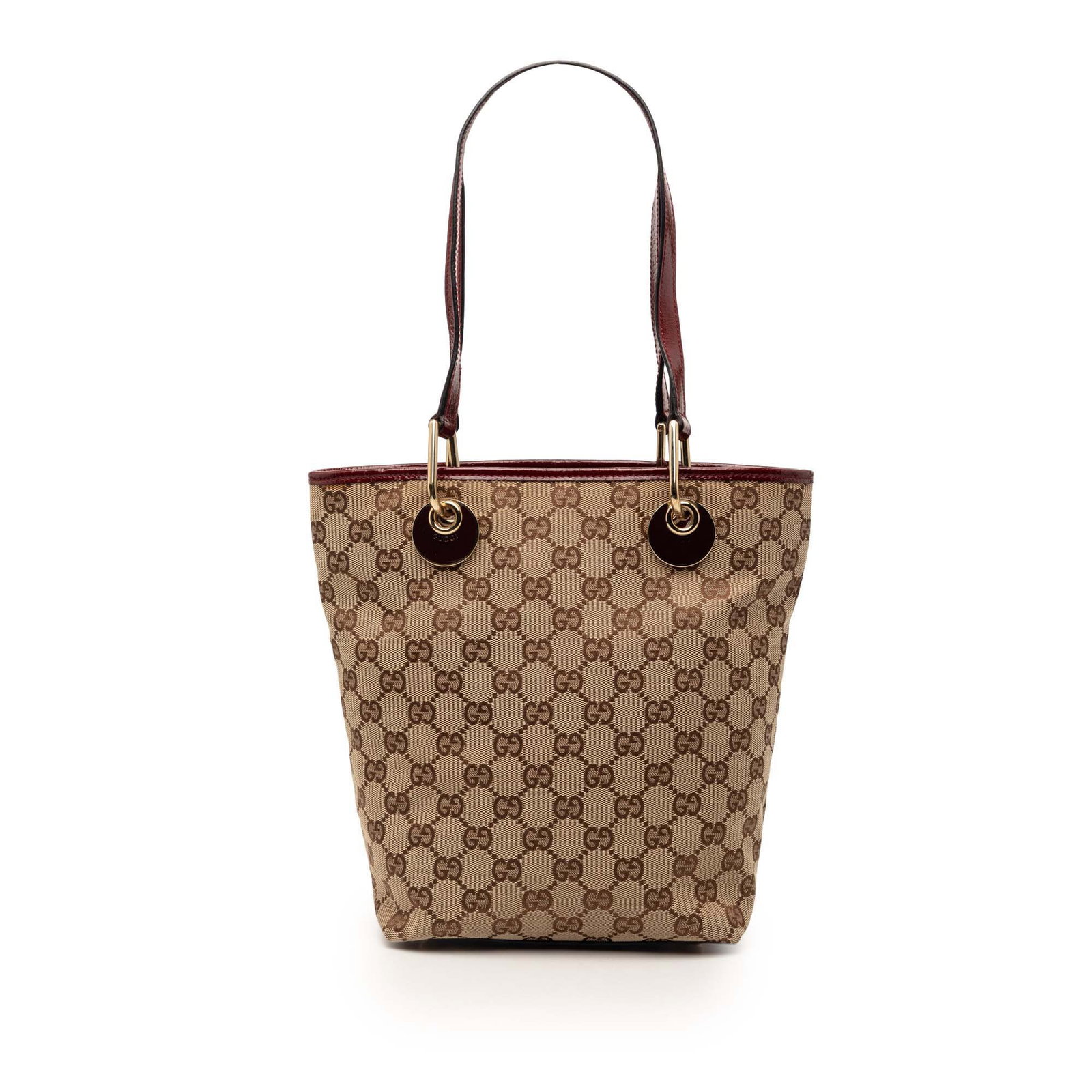 Gucci Eclipse GG canvas tote with leather trim: Gucci Eclipse GG canvas tote with leather trim This Gucci GG Canvas Eclipse Tote features a beige canvas body with leather trim, flat leather shoulder straps, an open top, and interior zip and slip po