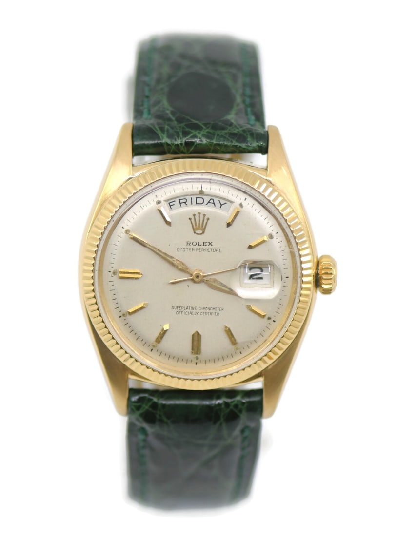 Rolex Day-Date 18K Yellow Gold Watch 36mm Green Leather Band: Rolex Day-Date 18K Yellow Gold Watch 36mm Green Leather Band This exquisite Rolex Day-Date wristwatch features a stunning 18K yellow gold case with a 36mm diameter, showcasing a classic analog display
