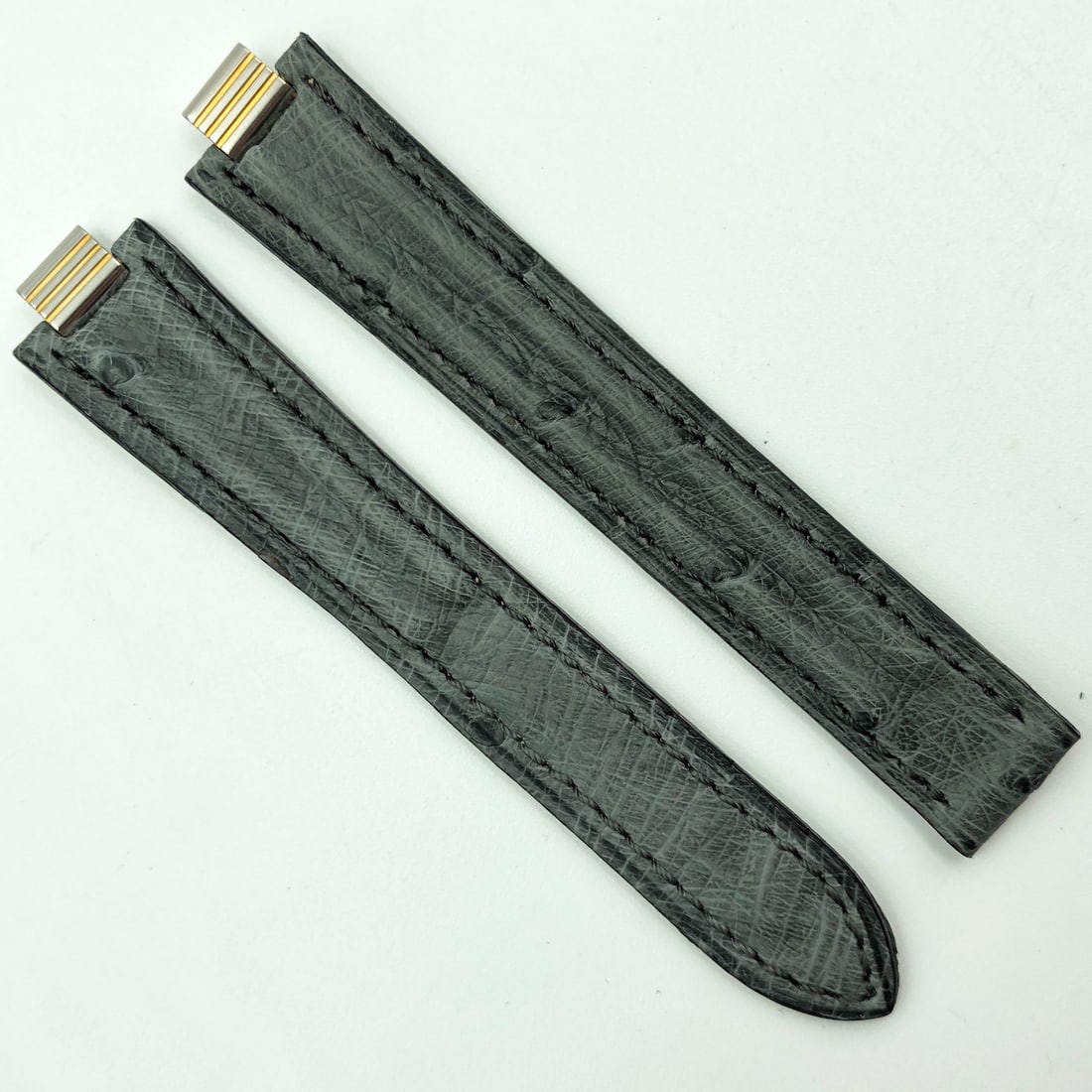 Cartier Authentic 7mm Gray Alligator Leather Deployant Strap: Cartier Authentic 7mm Gray Alligator Leather Deployant Strap Enhance your timepiece with this authentic Cartier 7mm gray alligator leather strap, designed specifically for deployant watches. The strap