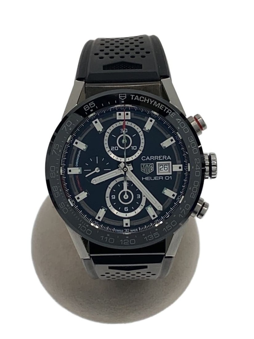 TAG Heuer Carrera Heuer 01 black rubber men's wristwatch: TAG Heuer Carrera Heuer 01 black rubber men's wristwatch This TAG HEUER Carrera Calibre Heuer 01 men's wristwatch features a black dial and a rubber strap. Crafted in Switzerland, it is designed for m