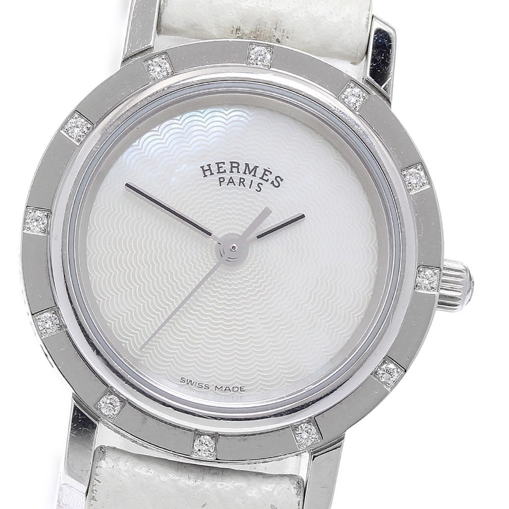 Hermes Clipper Nakule Quartz Ladies Wristwatch CL4.230: Hermes Clipper Nakule Quartz Ladies Wristwatch CL4.230 This pre-owned HERMES Clipper Nakule women's wristwatch features a stainless steel case paired with a white shell dial and a leather strap. The q