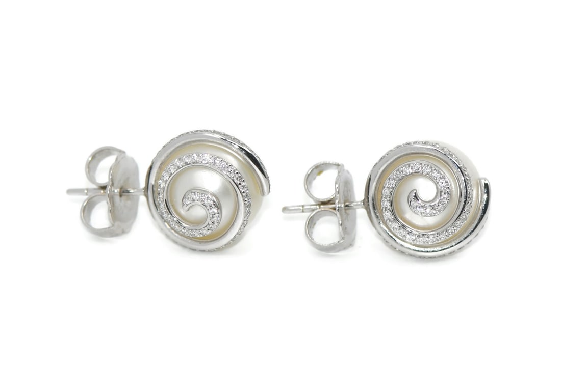 Mikimoto Pearl Diamond 18K White Gold Stud Earrings: Mikimoto Pearl Diamond 18K White Gold Stud Earrings These elegant stud earrings by Mikimoto feature lustrous pearls accented with sparkling diamonds, all set in 18K white gold. Crafted in Japan, they 