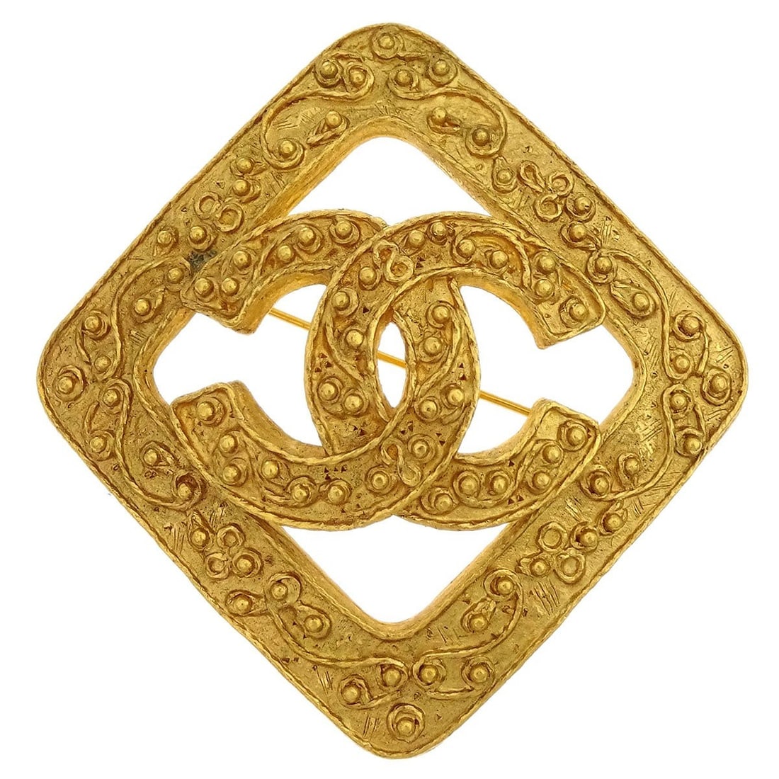 Chanel gold-tone logo brooch pin 94A: Chanel gold-tone logo brooch pin 94A This Chanel brooch features the iconic rhombus design in a gold-tone finish, showcasing the brand's signature logo motif. Made in France, this accessory offers a s