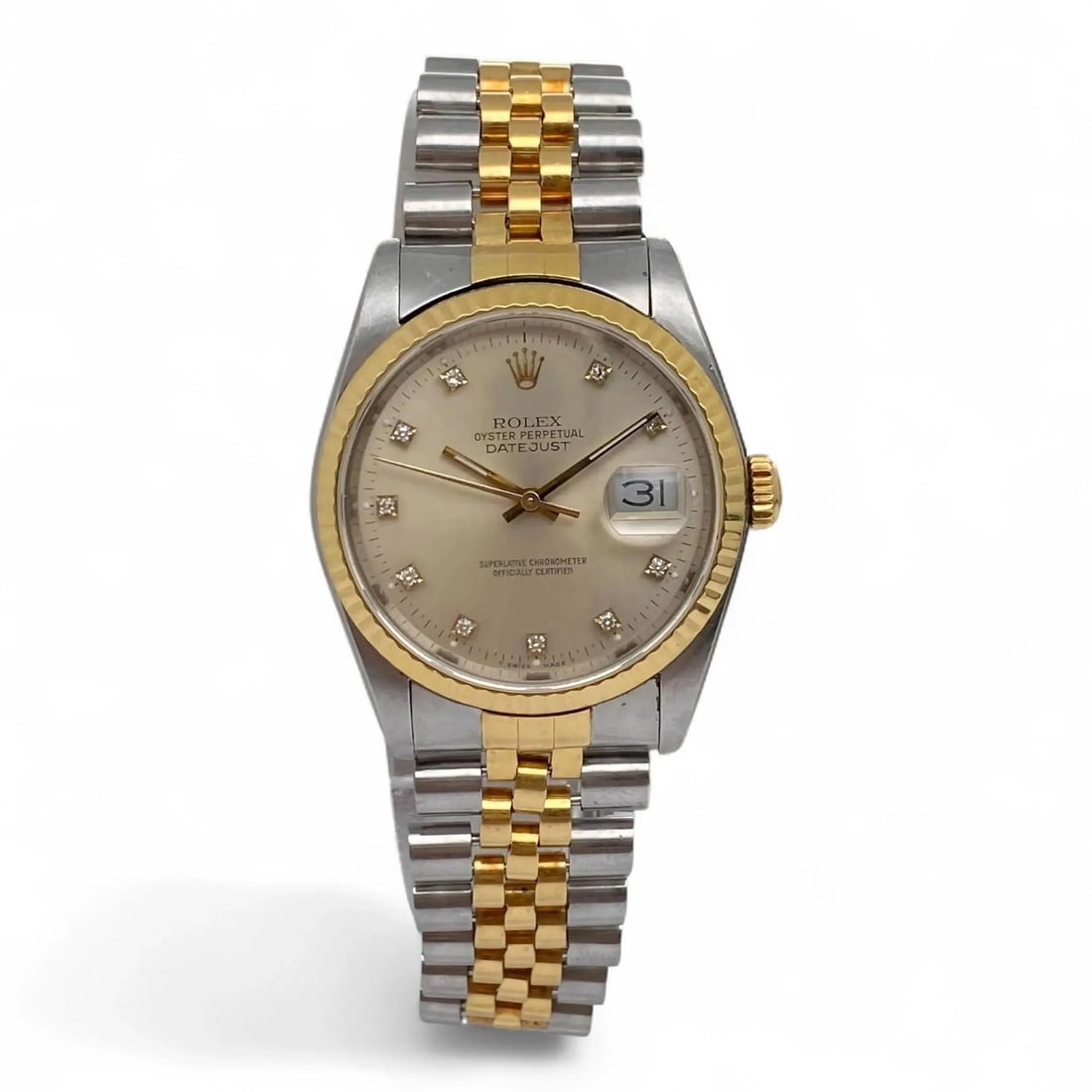 Rolex 36mm Datejust Silver Diamond Dial Wristwatch in Yellow Gold and Steel 16233: Rolex 36mm Datejust Silver Diamond Dial Wristwatch in Yellow Gold and Steel 16233 This Rolex Datejust 36mm wristwatch features an 18k yellow gold and stainless steel case, complemented by a factory ra