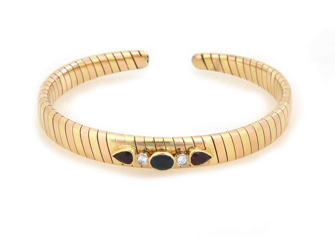 Elegant 18k Rose Yellow Gold Tubogas Flex Cuff Bracelet with Diamonds and Gemstones: Elegant 18k Rose Yellow Gold Tubogas Flex Cuff Bracelet with Diamonds and Gemstones Discover the elegance of this tapered flex cuff bracelet, expertly crafted from 18k rose and yellow gold in a stunni