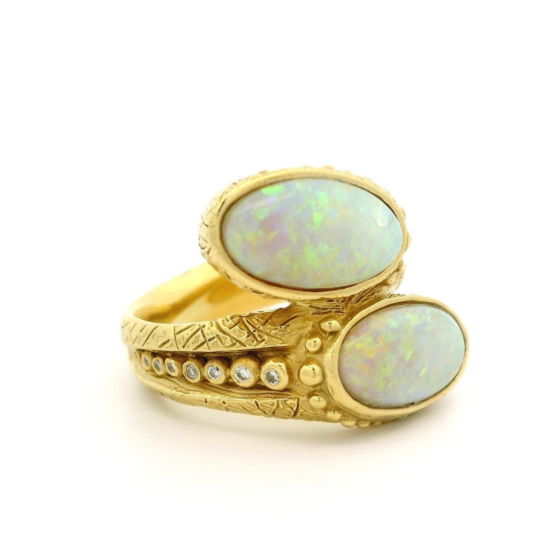 18k Yellow Gold Opal Diamond Textured Bead Bypass Ring: 18k Yellow Gold Opal Diamond Textured Bead Bypass Ring This exquisite bypass statement ring features a stunning design crafted in solid 18k yellow gold. The ring showcases two natural genuine opals, e