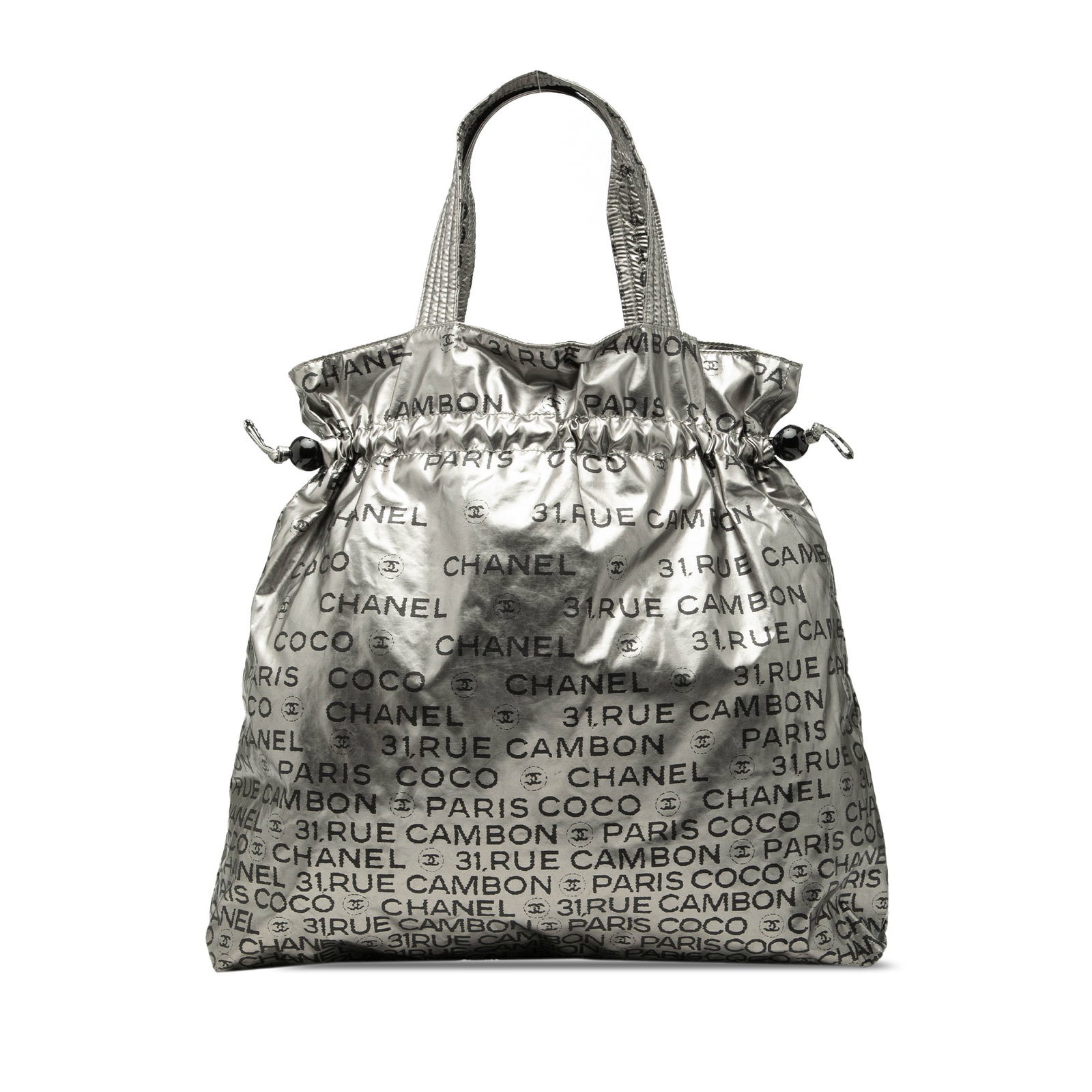 Chanel Unlimited metallic nylon tote with drawstring closure: Chanel Unlimited metallic nylon tote with drawstring closure This Chanel Nylon Unlimited Drawstring Tote features a metallic nylon body in silver, complemented by flat straps and a drawstring closure.