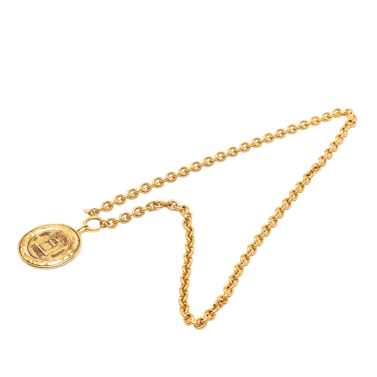Chanel 31 Rue Cambon Coin Pendant Gold Plated Metal Necklace: Chanel 31 Rue Cambon Coin Pendant Gold Plated Metal Necklace This Chanel necklace features a gold-plated metal body and a gold-tone curb chain adorned with a 31 Rue Cambon coin pendant. It is secured 