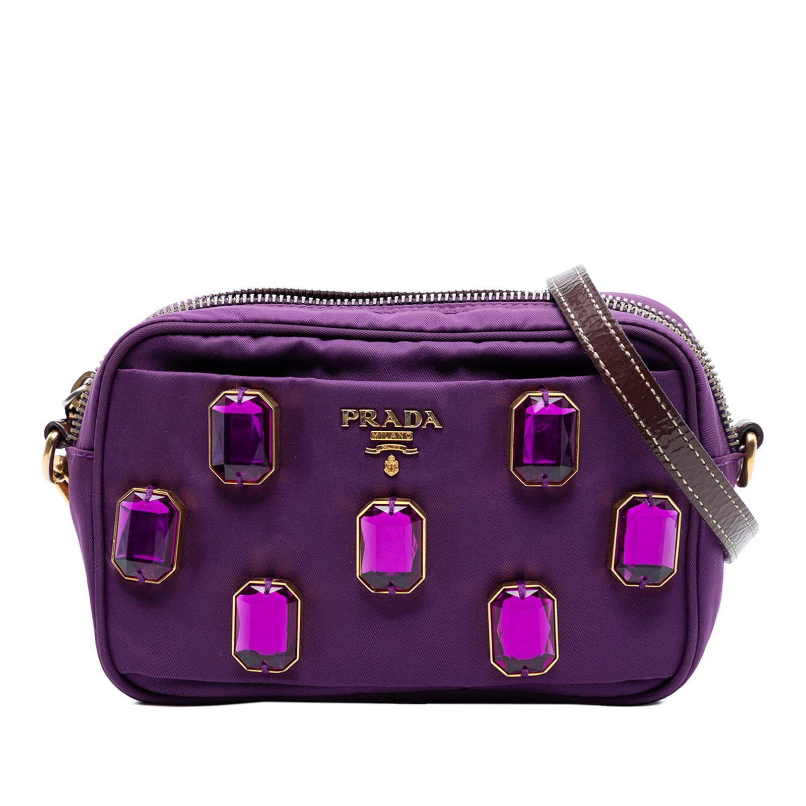 Embellished Purple Nylon Crossbody Prada Tessuto Pietre Camera Bag: Embellished Purple Nylon Crossbody Prada Tessuto Pietre Camera Bag This Prada Tessuto Pietre Camera Bag is a crossbody style crafted from embellished purple nylon fabric. It features an adjustable and