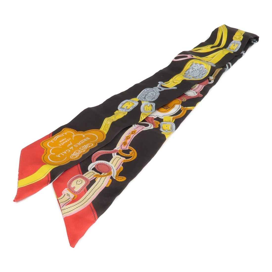 Hermes silk Twilly scarf in black yellow red: Hermes silk Twilly scarf in black yellow red This Hermes Twilly scarf is crafted from luxurious silk and features a striking combination of black, yellow, and red colors. Designed for women, this eleg