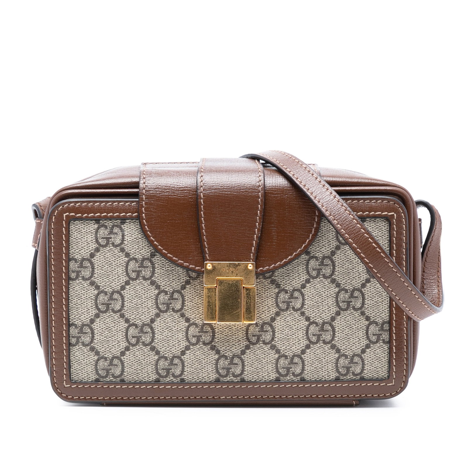 Beige Mini GG Supreme Canvas Crossbody Bag with Clasp by Gucci: Beige Mini GG Supreme Canvas Crossbody Bag with Clasp by Gucci This Gucci Mini GG Supreme Clasp Crossbody bag features a coated canvas body with leather trim, an adjustable flat leather strap, a front