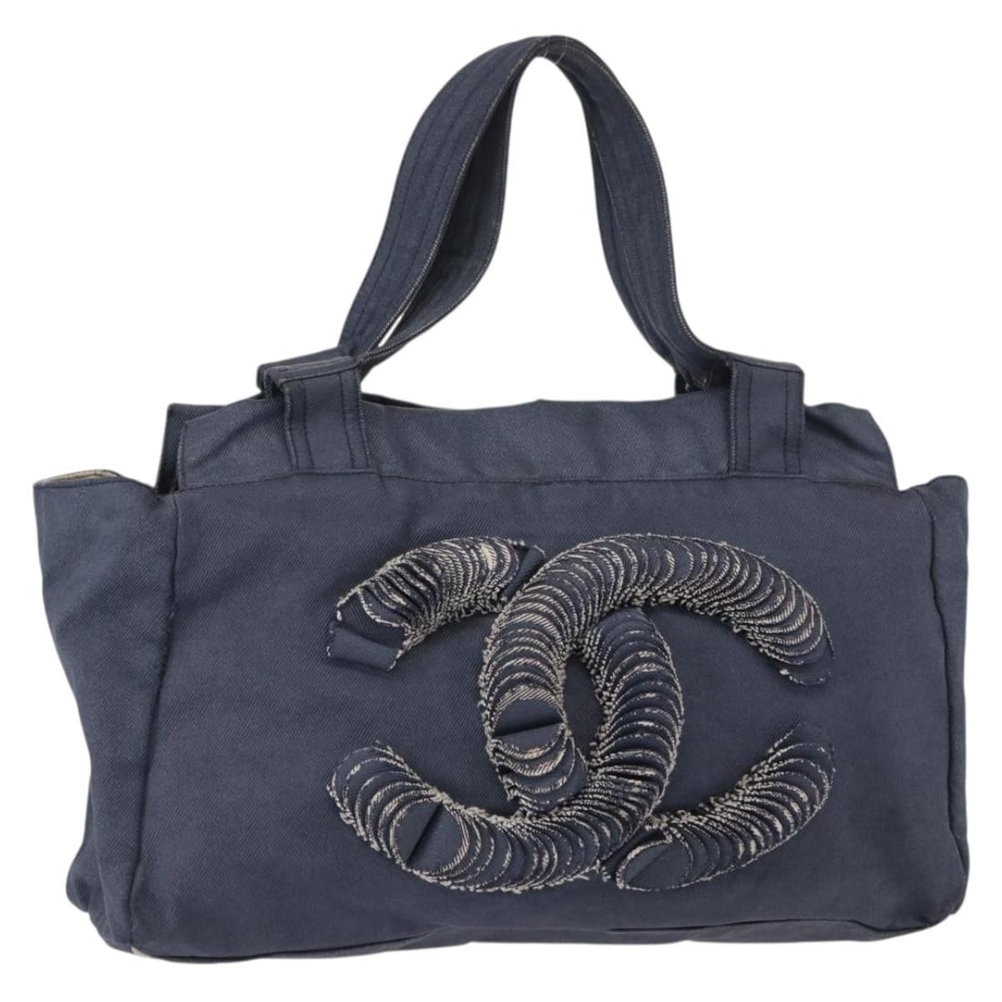 CHANEL Denim Blue Tote Bag Made in Italy with CC Logo: CHANEL Denim Blue Tote Bag Made in Italy with CC Logo This CHANEL Tote Bag is a stylish accessory crafted in Italy from durable canvas in a chic blue color. The bag features a spacious interior and a 