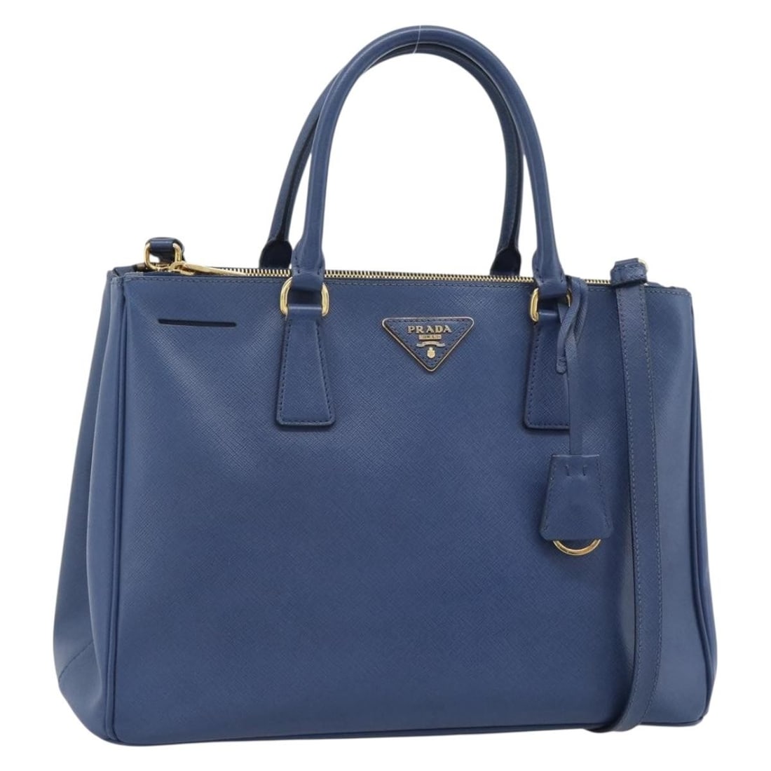 Prada Galleria saffiano leather blue gold handbag with strap: Prada Galleria saffiano leather blue gold handbag with strap This PRADA Galleria handbag is crafted from Saffiano leather in a blue and gold color combination. It features both top handles and a detac