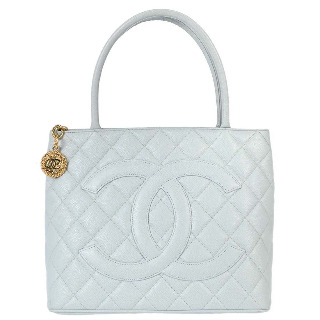 CHANEL Medallion blue caviar leather tote handbag: CHANEL Medallion blue caviar leather tote handbag This Chanel Medallion tote handbag is crafted from blue caviar skin leather and features a matelasse quilted pattern with logo accents. The medium-siz