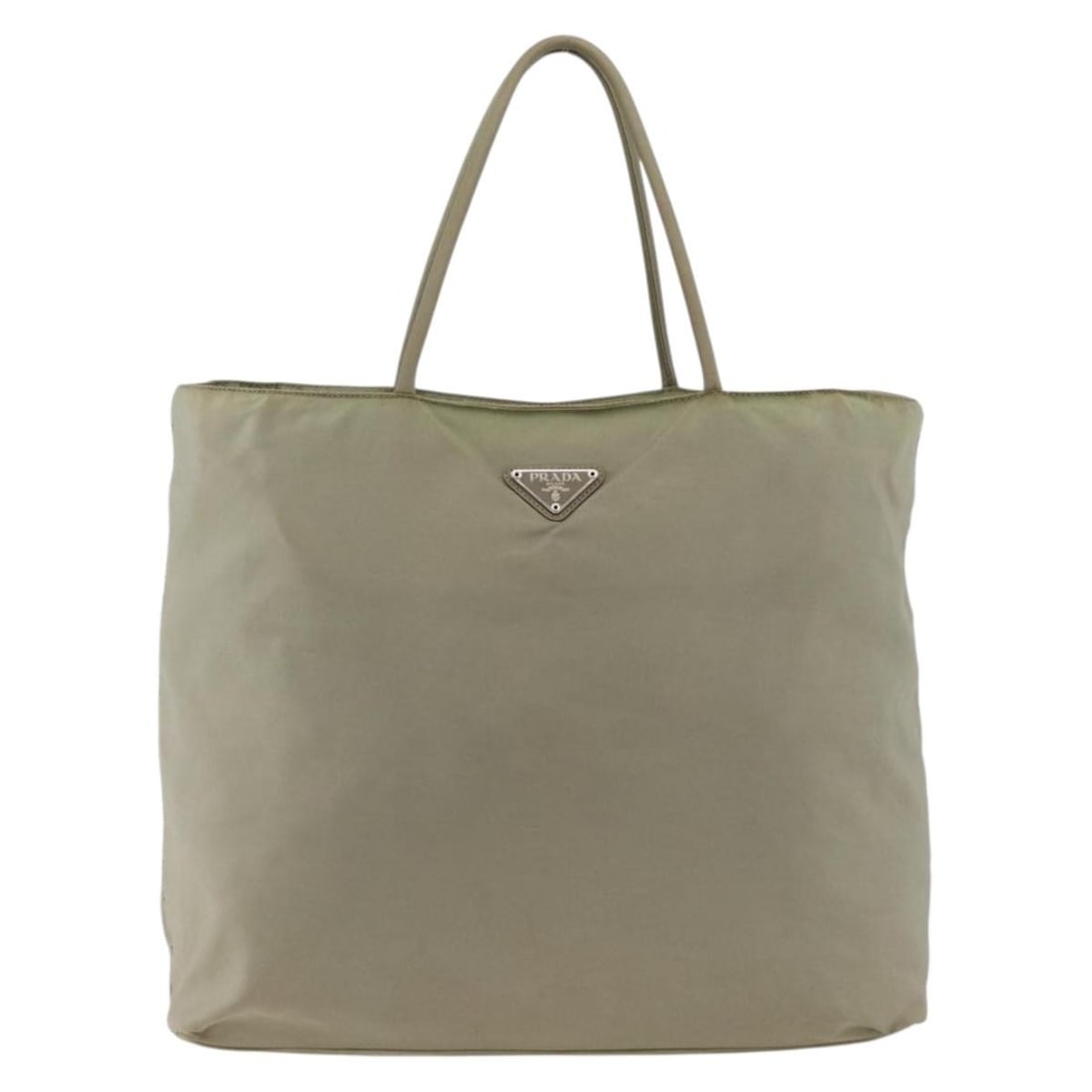 Beige Nylon Tote Bag Prada Vintage Collection Italy: Beige Nylon Tote Bag Prada Vintage Collection Italy This Prada Vintage Tote is crafted from beige nylon and designed for women. The bag features signs of wear, including rubbing and stains on the exte