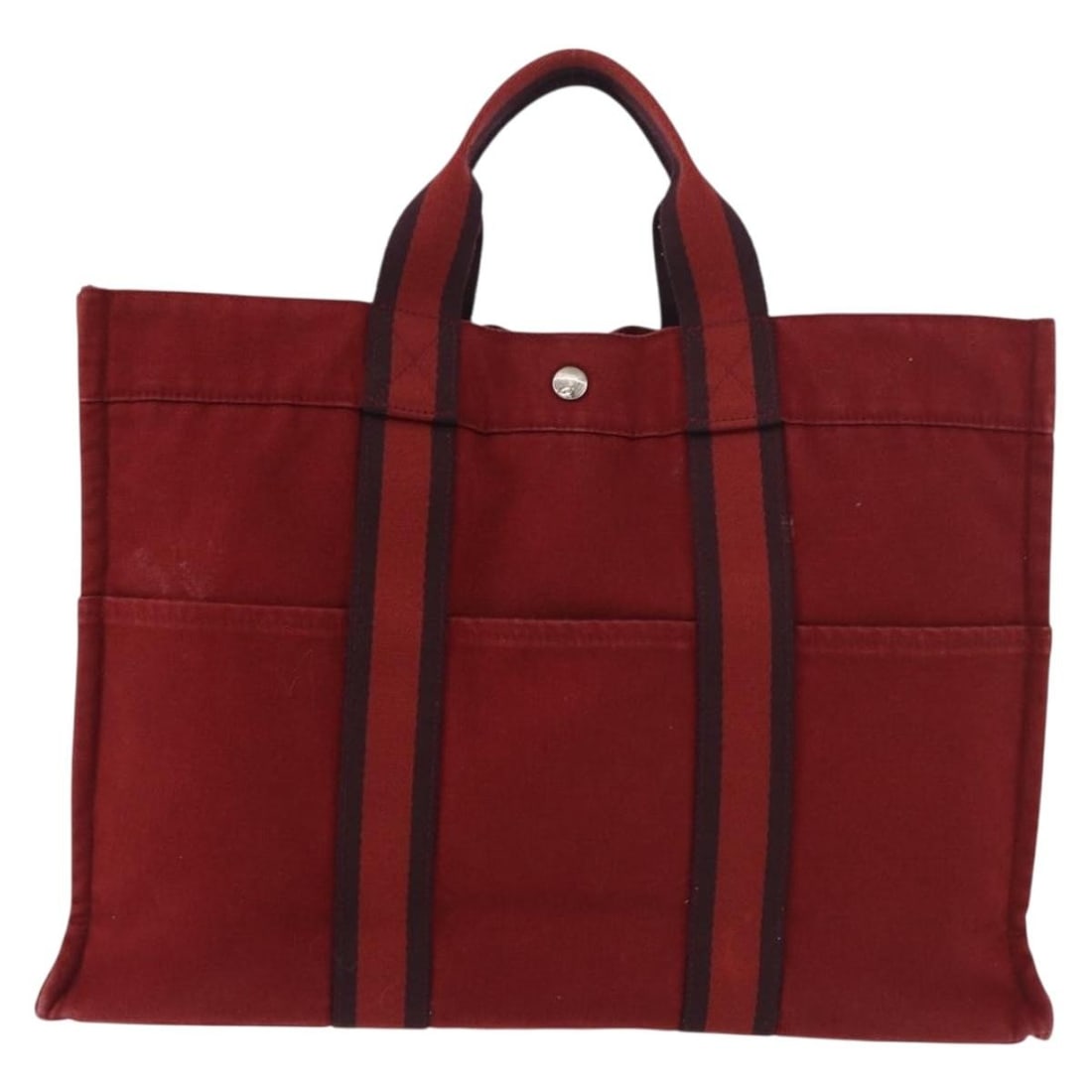 Hermes Fourre Tout red canvas tote: Hermes Fourre Tout red canvas tote This Hermes Fourre Tout Tote is crafted from durable red canvas and designed for women. It features a spacious interior and sturdy handles, making it practical for e