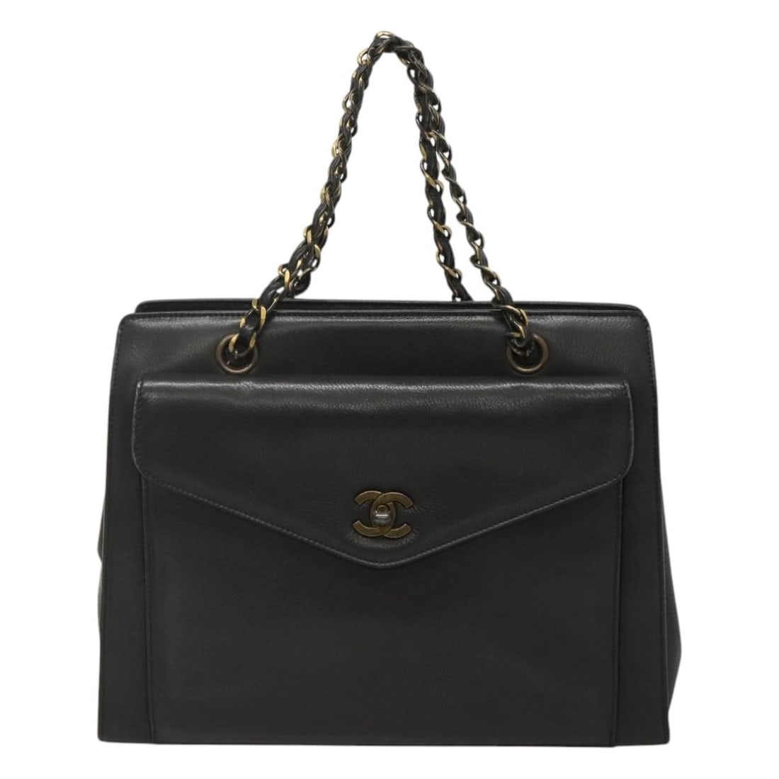 Chanel black leather vintage chain tote with front pocket: Chanel black leather vintage chain tote with front pocket This Chanel Vintage Front Pocket Chain Tote is crafted from black leather and features a classic chain strap design. The tote includes a conve