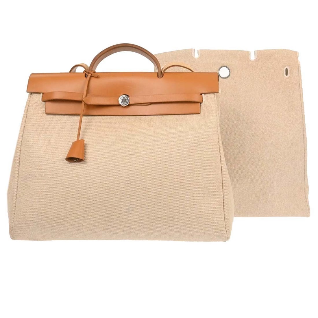 Hermes Herbag MM Canvas Leather Shoulder and Top Handle Bag with Detachable Strap: Hermes Herbag MM Canvas Leather Shoulder and Top Handle Bag with Detachable Strap This Hermes Herbag MM 2-in-1 handbag features a beige canvas exterior with leather accents and a brown top handle. Des