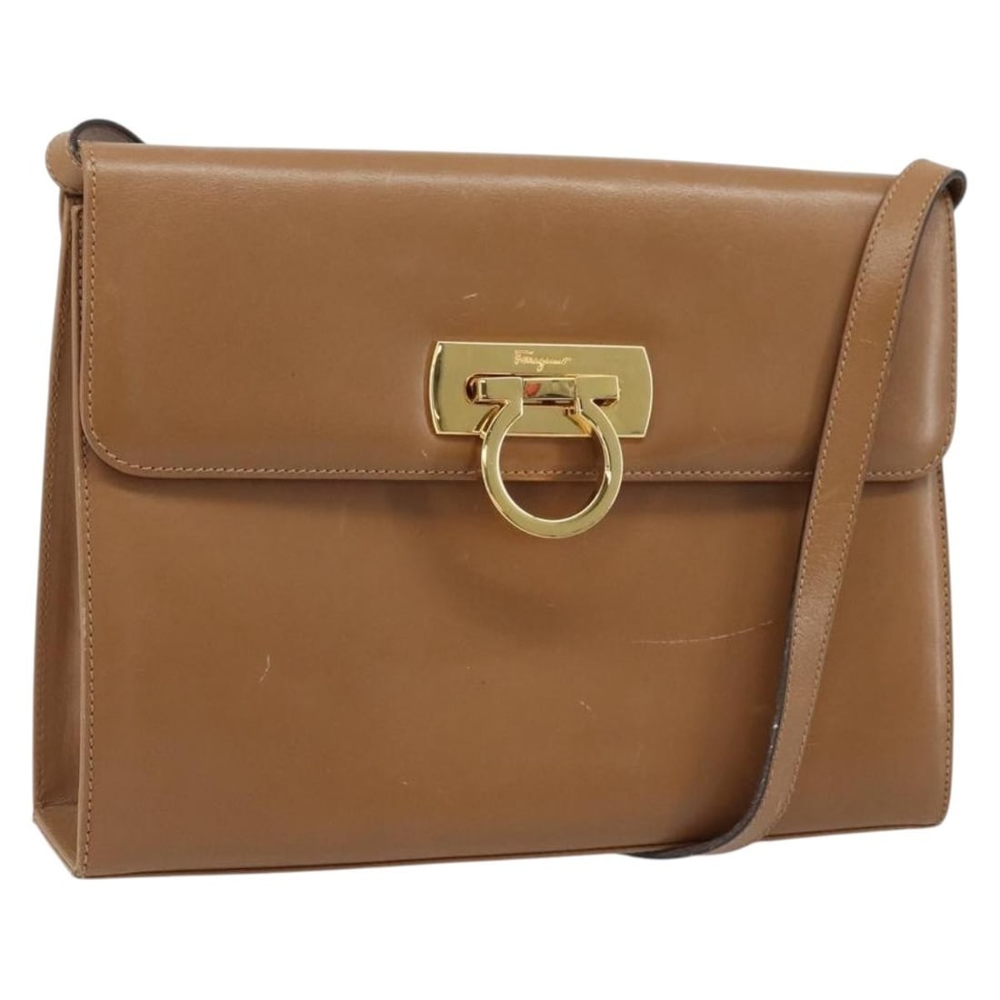 Brown Leather Gancini Shoulder Bag by Salvatore Ferragamo Gold Accents: Brown Leather Gancini Shoulder Bag by Salvatore Ferragamo Gold Accents This Salvatore Ferragamo Gancini shoulder bag features brown leather accented with gold-tone details. Designed for women, the bag