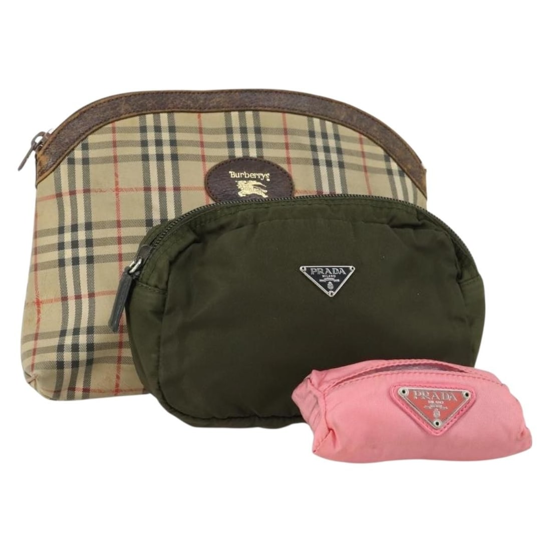 Set of 3 Burberrys Nylon Pouches in Pink Brown and Beige: Set of 3 Burberrys Nylon Pouches in Pink Brown and Beige This Burberrys pouch set features three pouches crafted from nylon canvas in a pink, brown, and beige Nova Check pattern. The set is heavily us