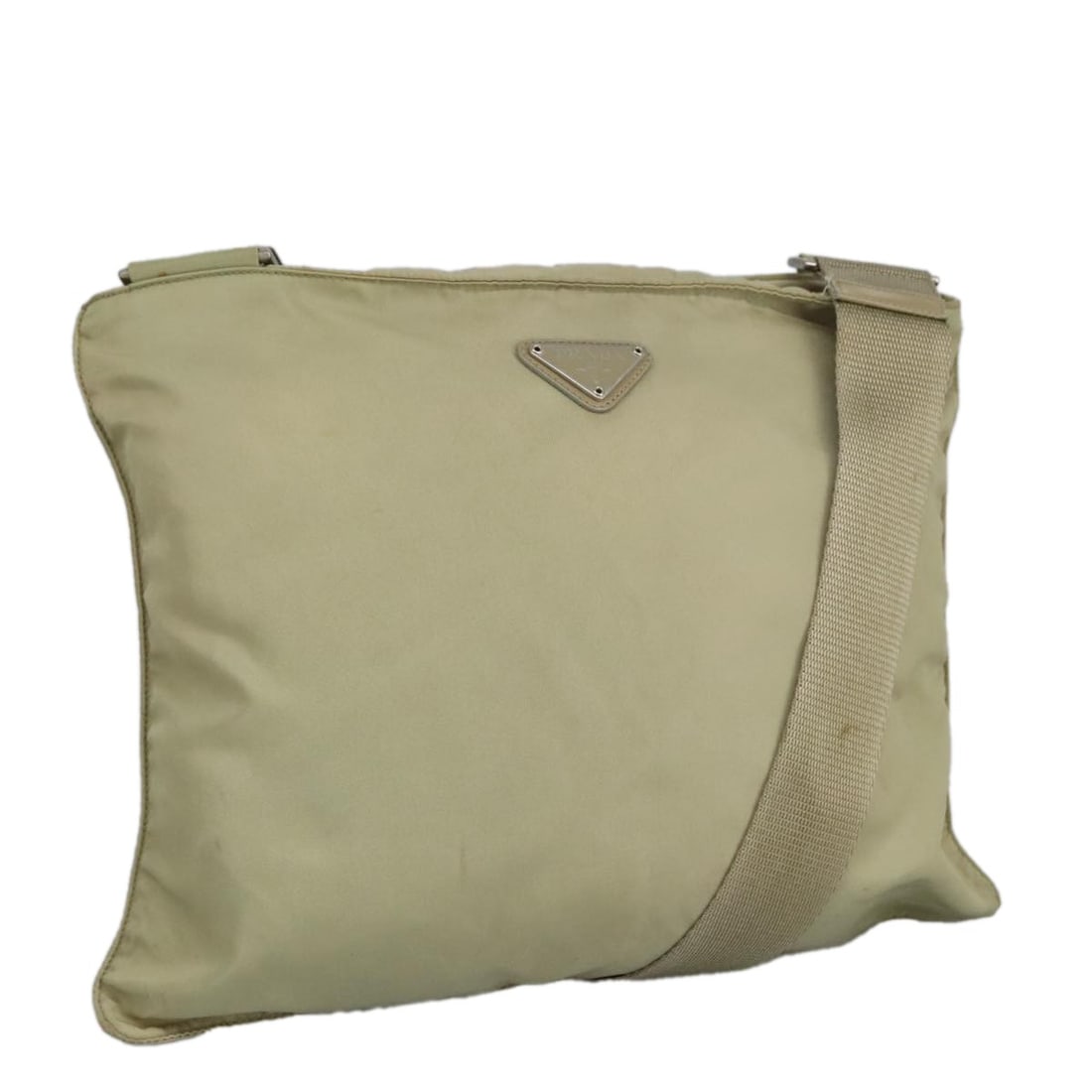 Prada Beige Nylon Shoulder Purse with Silver Accents Italy: Prada Beige Nylon Shoulder Purse with Silver Accents Italy This PRADA women's shoulder bag is crafted from beige nylon with silver-tone accents. Made in Italy, the bag features an adjustable shoulder 