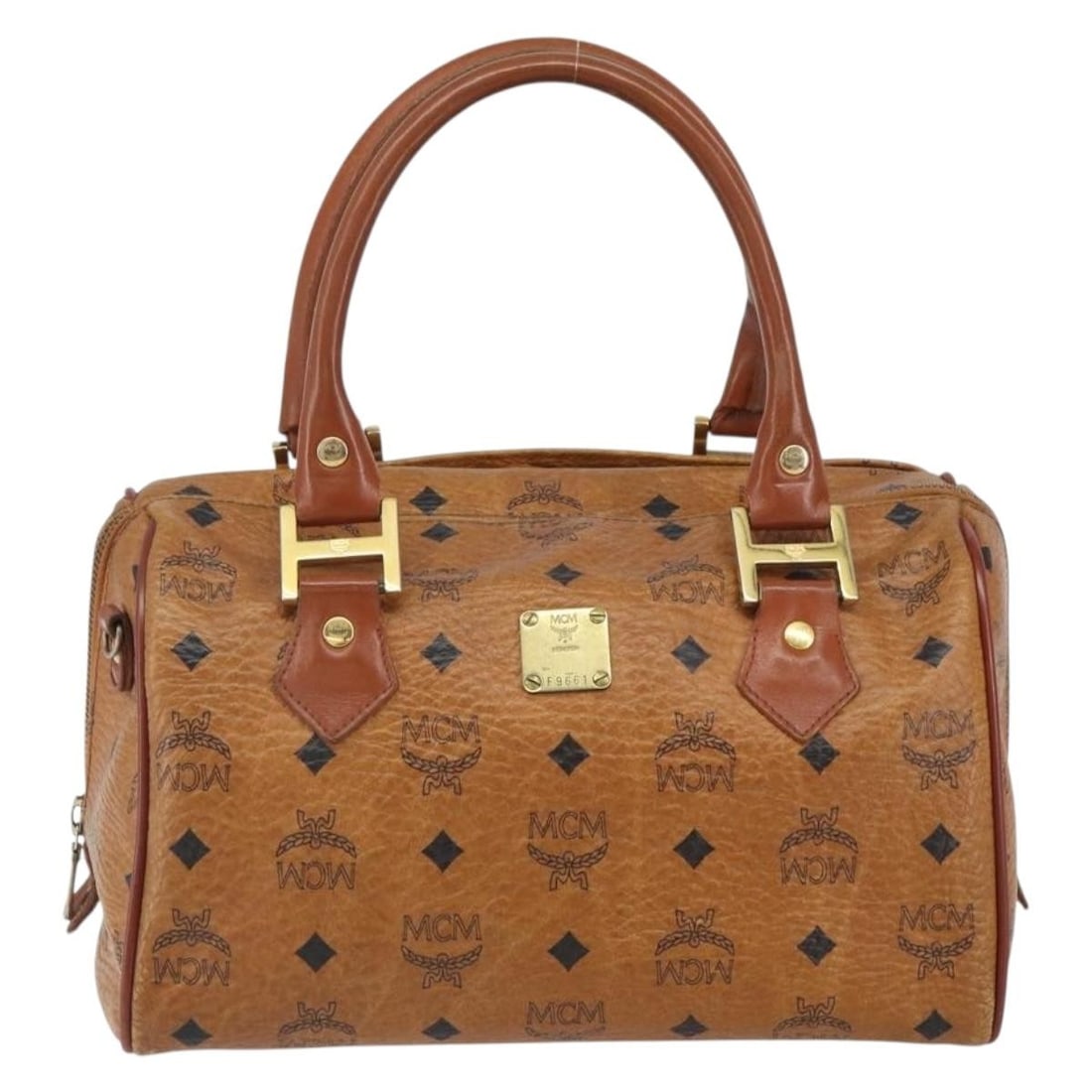Brown Canvas and Leather MCM Visetos Handbag 26cm by 16cm by 15cm: Brown Canvas and Leather MCM Visetos Handbag 26cm by 16cm by 15cm This MCM Visetos handbag for women features a brown canvas body with leather accents. It has a compact design measuring 26cm x 16cm x 