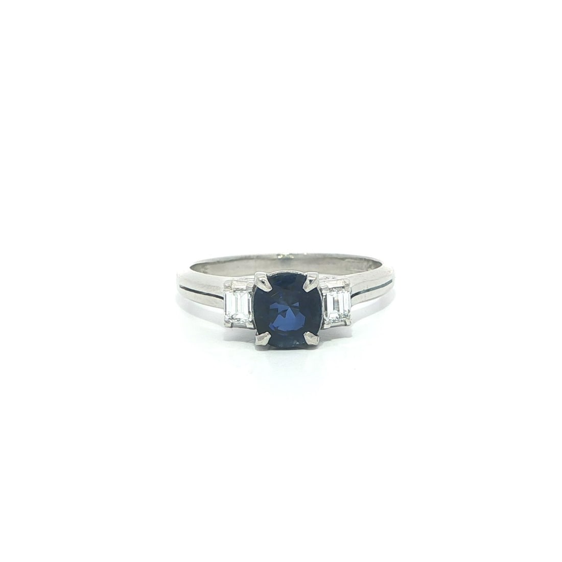 Platinum Cocktail Ring With GIA Ceylon No Heat Blue Sapphire and Baguette Diamonds: Platinum Cocktail Ring With GIA Ceylon No Heat Blue Sapphire and Baguette Diamonds This classic cocktail ring features a natural, no-heat Ceylon sapphire in a cushion cut, certified by GIA. The vibran