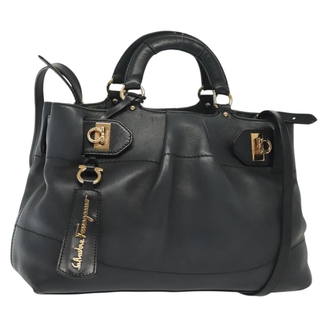 Salvatore Ferragamo Navy Gold Gancini Leather Hand Bag 2-Way Authentic: Salvatore Ferragamo Navy Gold Gancini Leather Hand Bag 2-Way Authentic This Salvatore Ferragamo Gancini Hand Bag is a luxurious accessory made from high-quality leather, featuring a stunning navy and 
